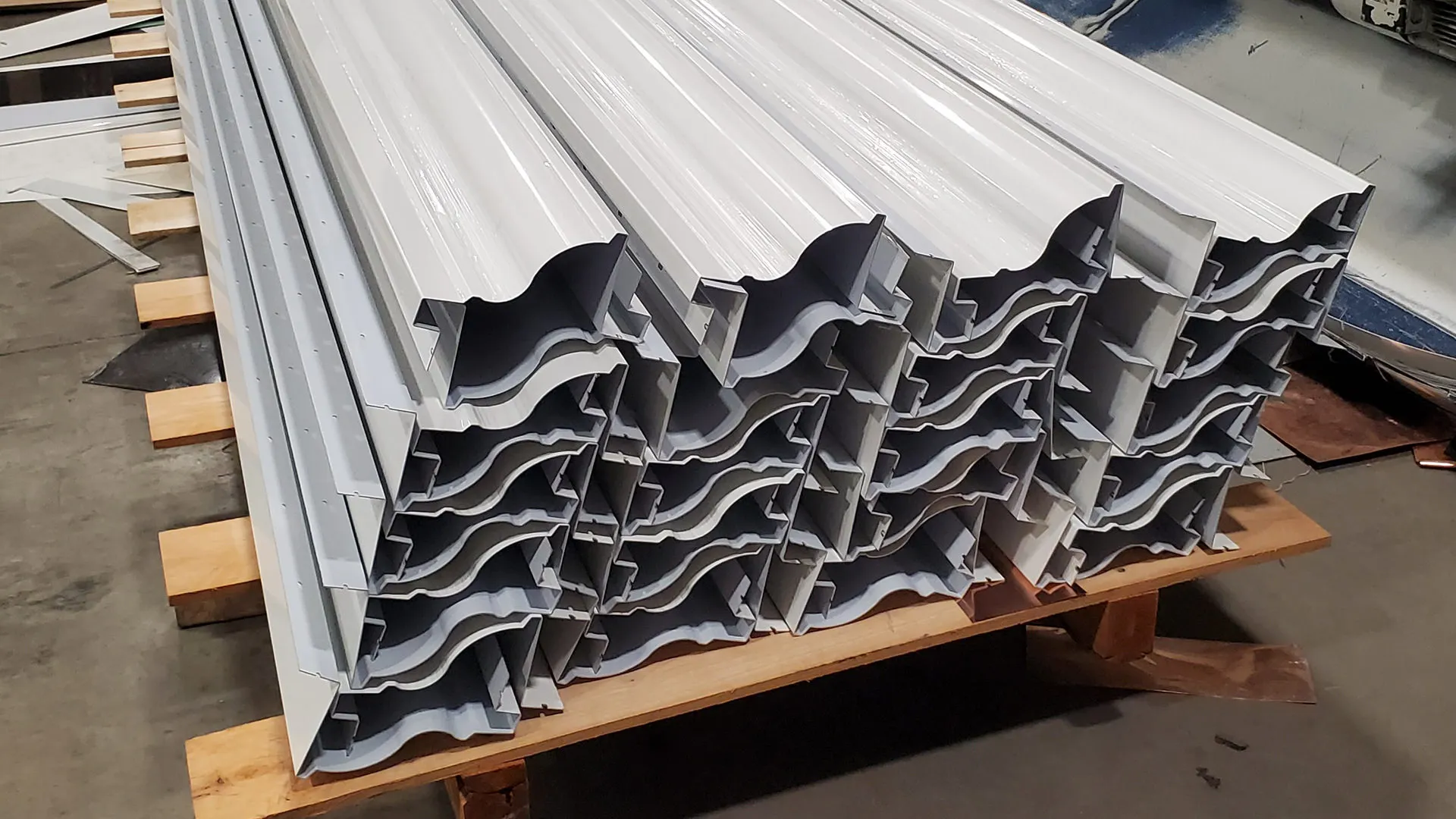 White Kynar-finished aluminum cornice made to a custom profile