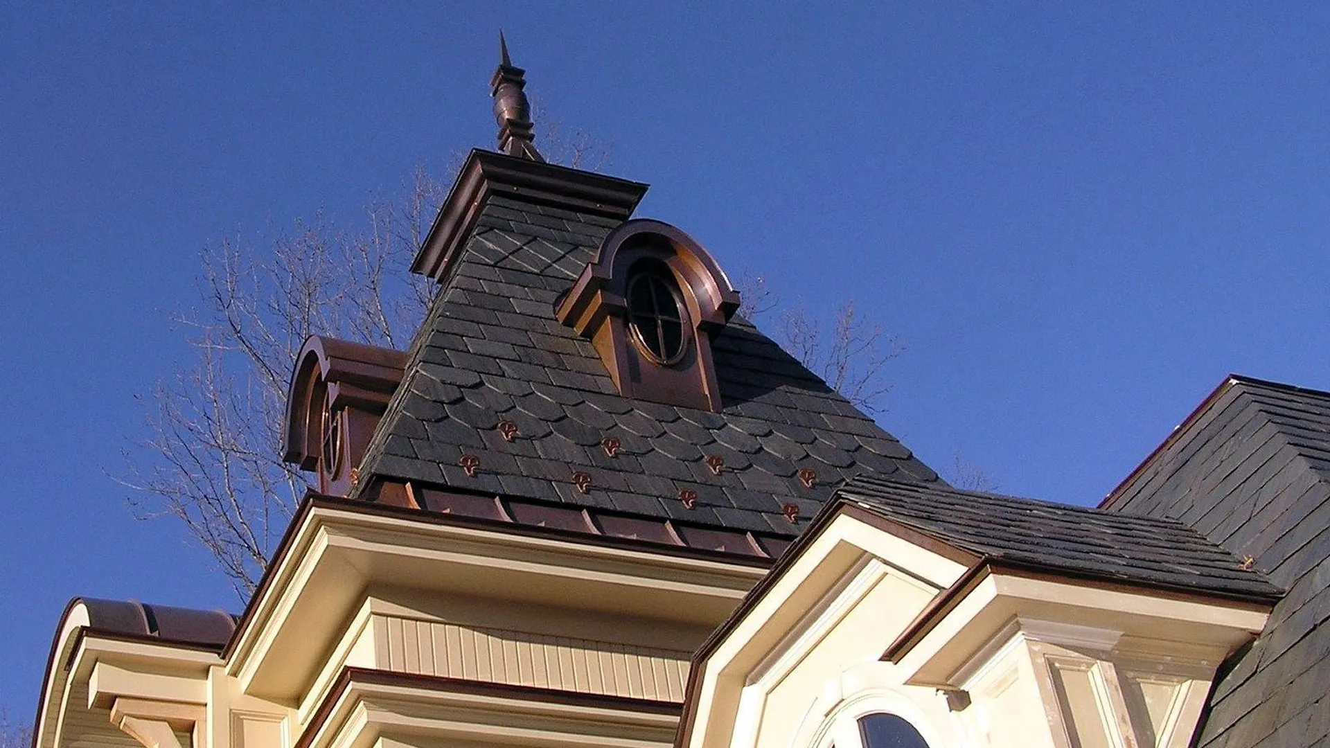 Copper swoop panels, custom dormers and finial