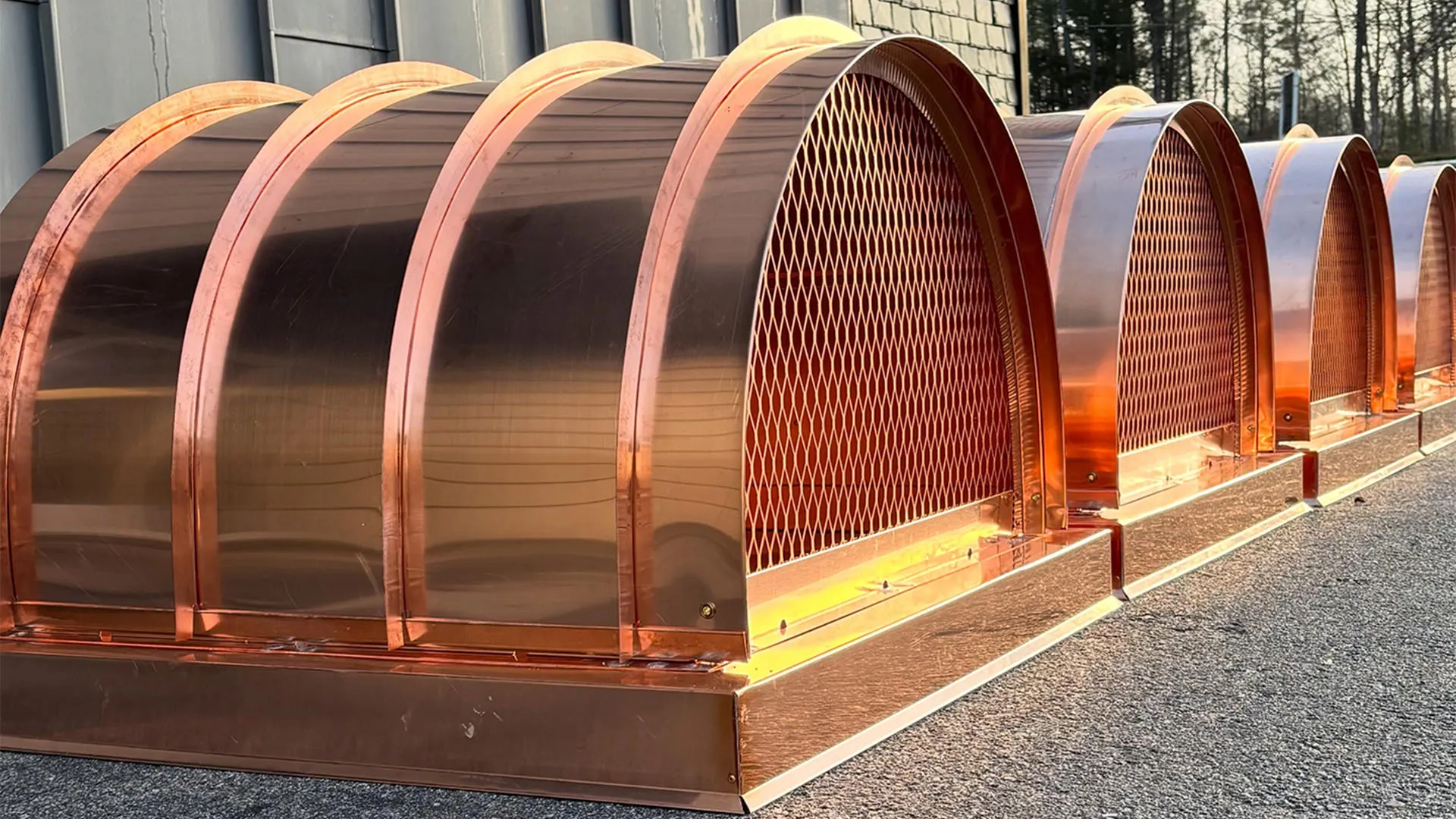 Copper side-mount chimney caps with barrel roofs