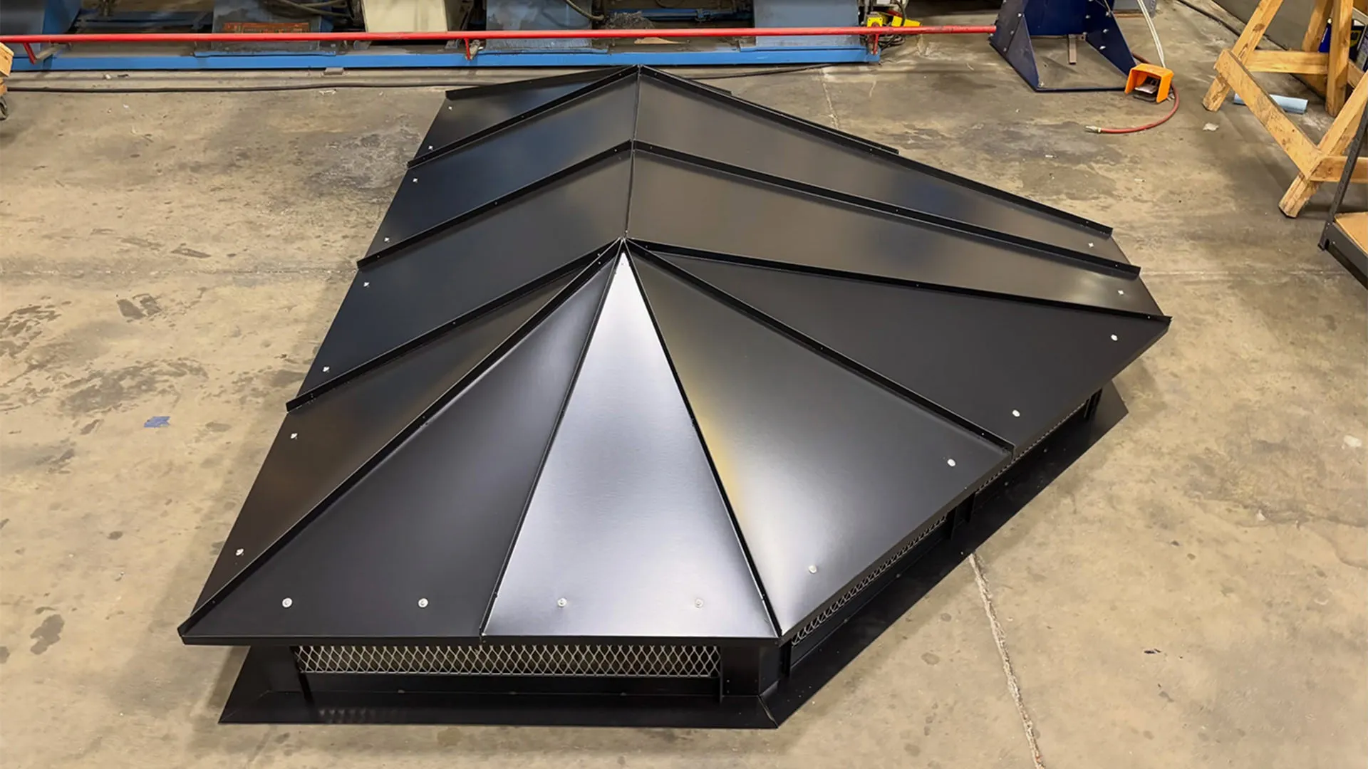 Custom black panel-roof chimney cap