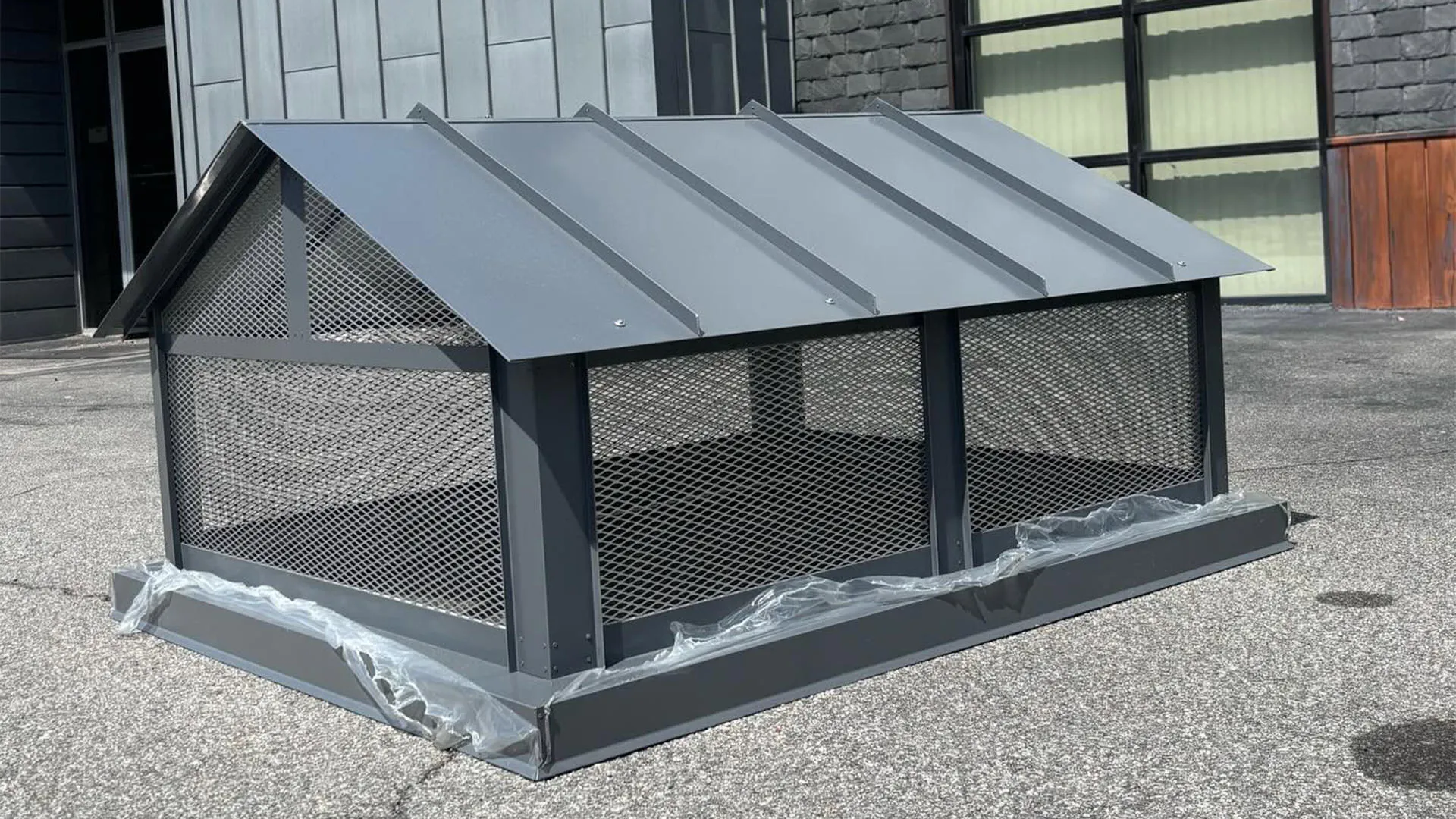 Gable-roof chimney cap in charcoal Kynar-finished steel