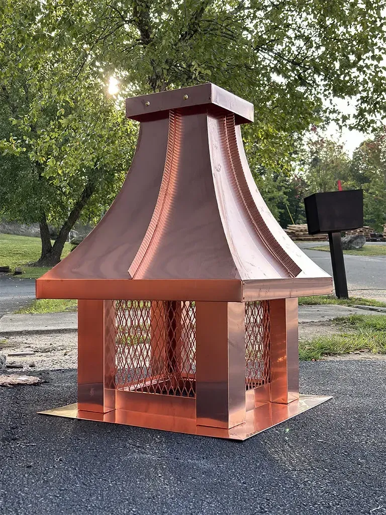 Small concave chimney cap in copper