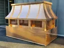 Decorative copper  concave standing seam radius roof chimney cap