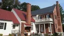 Snap Lock Roofing Panel - Red Panels on a Home